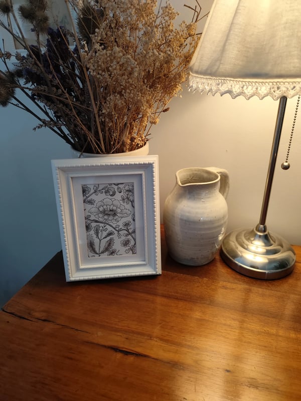 1747224603793Fleursennoiretblanc_frame.webp
